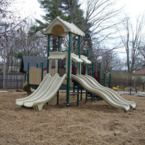 Playground unit installed on wood mulch.